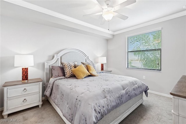 bedroom featuring crown molding, ceiling fan, baseboards, and light colored carpet