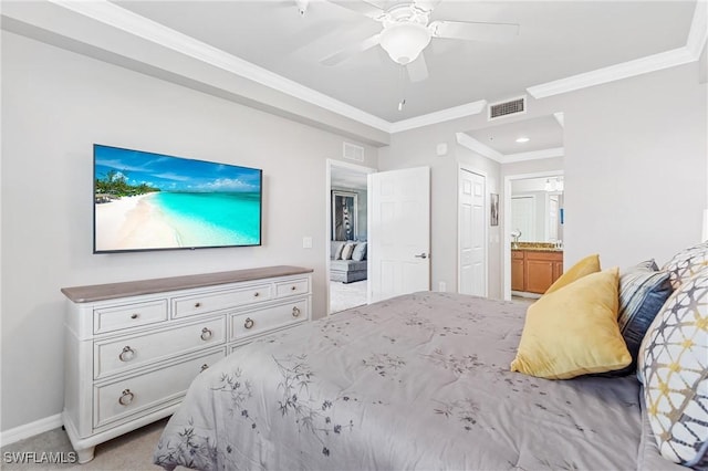 bedroom with light carpet, baseboards, visible vents, ornamental molding, and ensuite bathroom