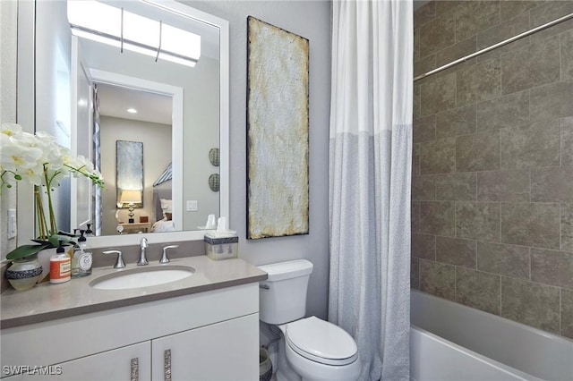 bathroom featuring shower / tub combo, vanity, and toilet