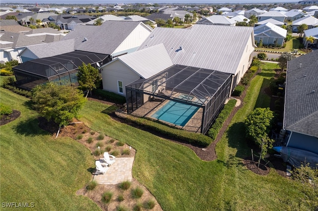 birds eye view of property with a residential view