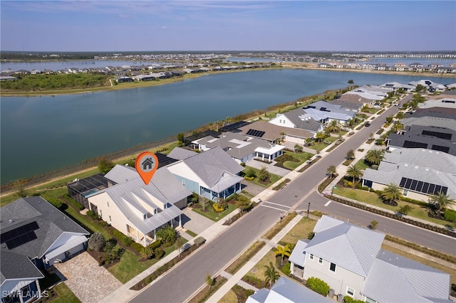 bird's eye view with a water view and a residential view