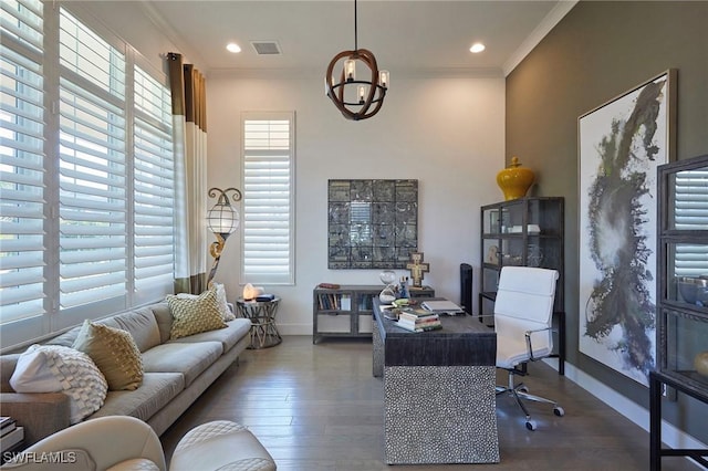 office area with a healthy amount of sunlight, visible vents, ornamental molding, and wood finished floors