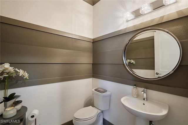 bathroom with a sink and toilet