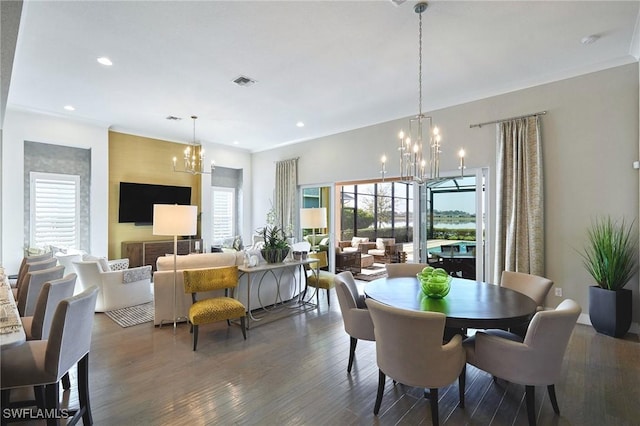 dining area with visible vents, dark wood finished floors, a notable chandelier, and recessed lighting