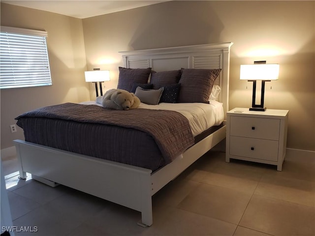 bedroom with light tile patterned flooring