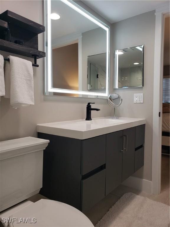 bathroom with vanity and toilet