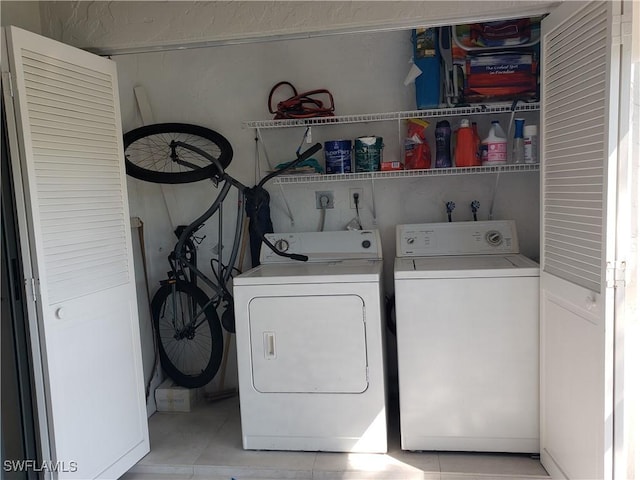 washroom with laundry area and washing machine and clothes dryer