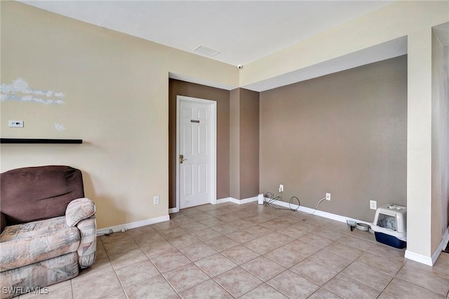 washroom featuring light tile patterned floors, visible vents, and baseboards