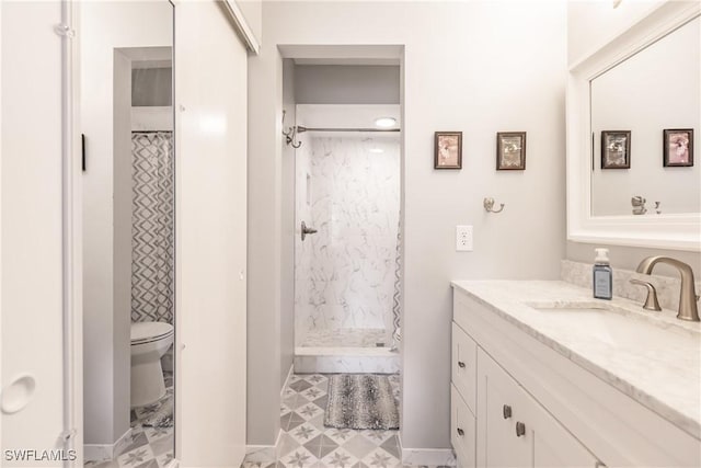 full bathroom with toilet, walk in shower, and vanity