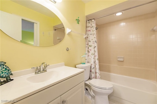 full bathroom featuring recessed lighting, shower / tub combo with curtain, vanity, and toilet