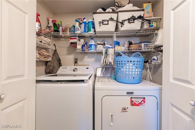 laundry area featuring laundry area and washing machine and dryer