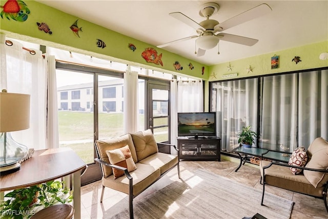 sunroom featuring ceiling fan