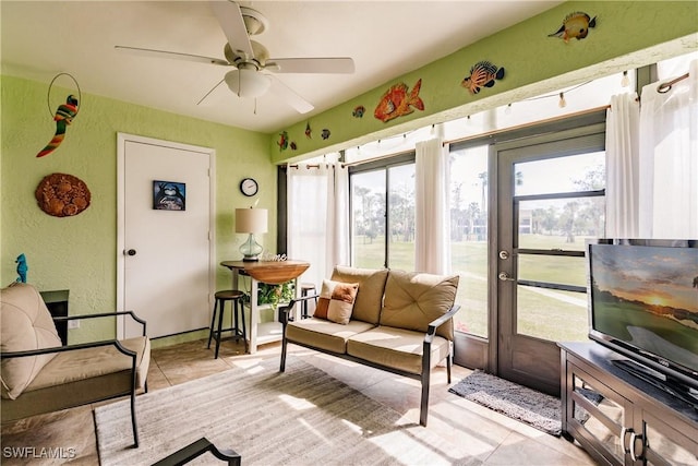 sunroom / solarium with ceiling fan