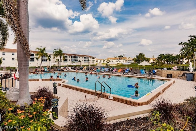 pool featuring a patio area and fence