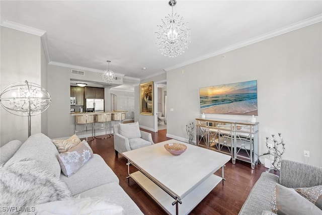 living area with a chandelier, visible vents, ornamental molding, and dark wood-type flooring