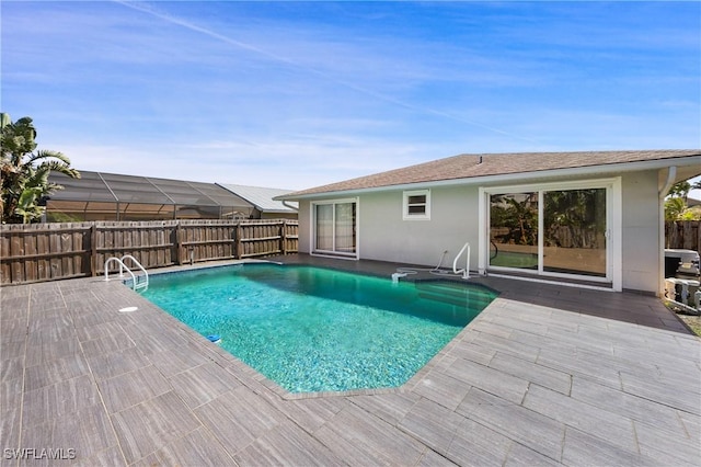 view of pool featuring a patio area, fence, and a fenced in pool