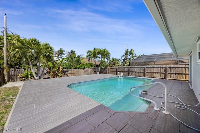 view of swimming pool with a patio area, a fenced backyard, and a fenced in pool