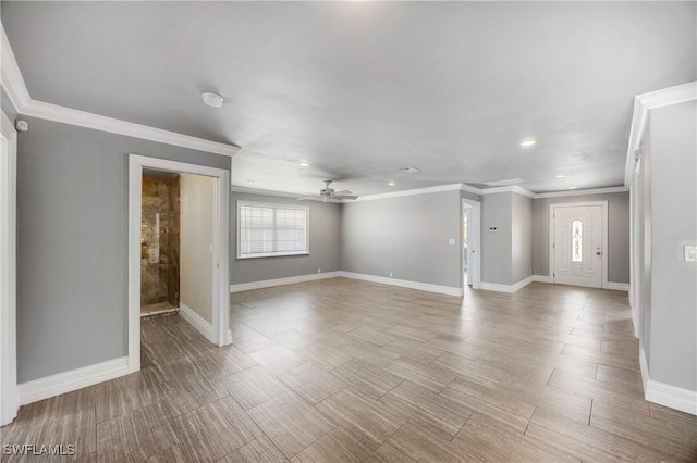 unfurnished living room featuring plenty of natural light, baseboards, and ceiling fan