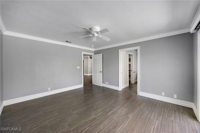 empty room with visible vents, crown molding, baseboards, and a ceiling fan