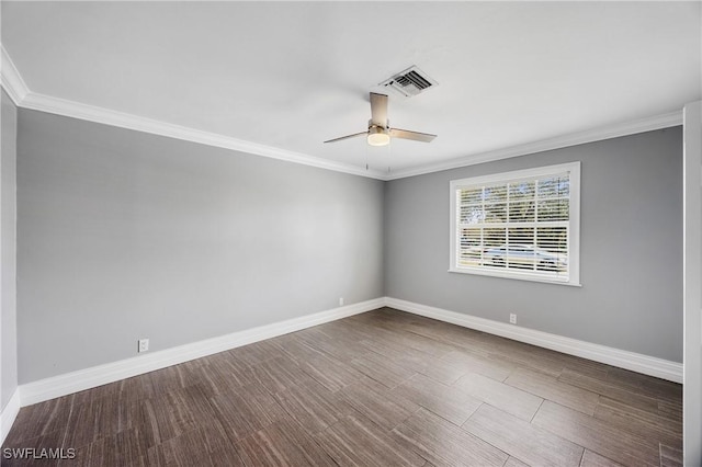 empty room with baseboards, visible vents, and a ceiling fan