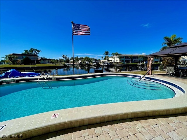 community pool featuring a water view