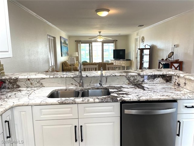 kitchen featuring visible vents, white cabinets, crown molding, stainless steel dishwasher, and a sink