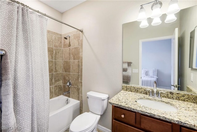 bathroom featuring shower / bath combo, vanity, and toilet