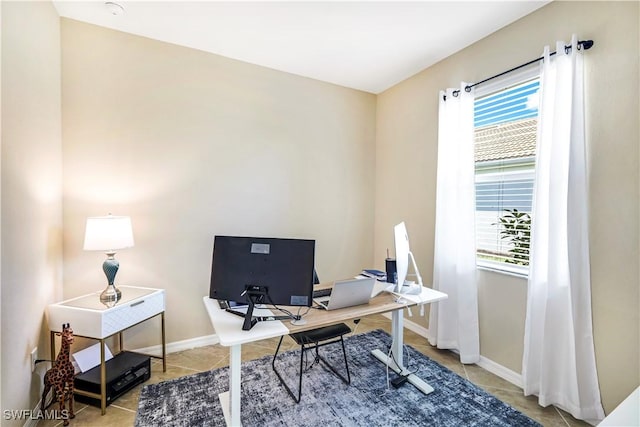 office area featuring tile patterned flooring and baseboards