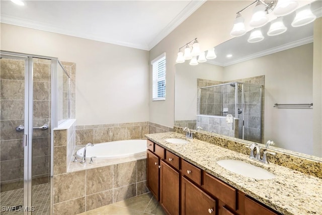 bathroom featuring a bath, tile patterned flooring, a shower stall, and a sink