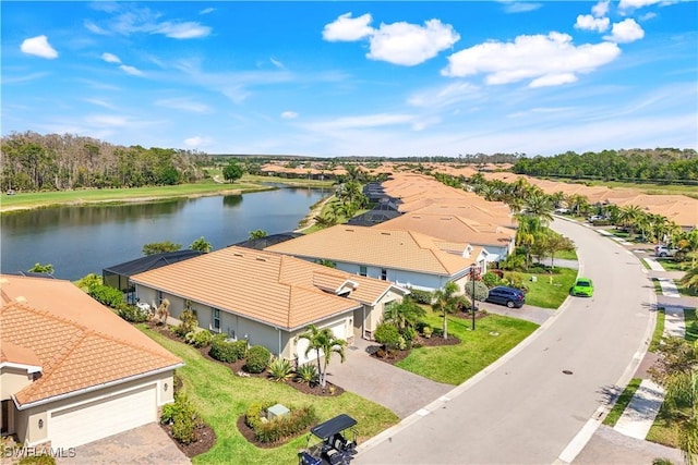 birds eye view of property with a residential view and a water view