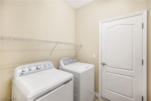 laundry room featuring laundry area and washing machine and dryer