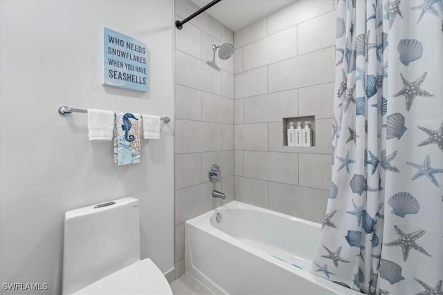 bathroom with toilet and shower / bath combo with shower curtain