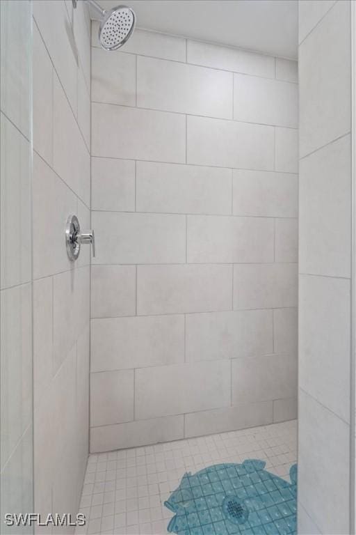 bathroom with a tile shower