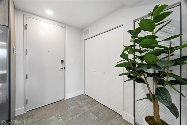 foyer entrance featuring recessed lighting and visible vents