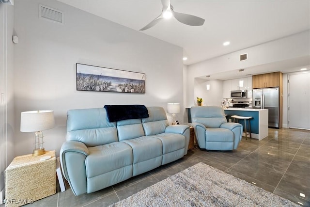 living room featuring recessed lighting, visible vents, and a ceiling fan