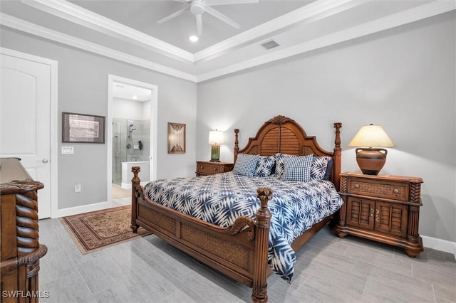 bedroom with baseboards, visible vents, ornamental molding, ensuite bathroom, and a tray ceiling