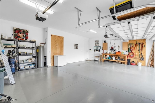 garage featuring a workshop area, gas water heater, and a garage door opener