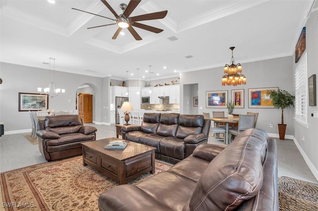 living room featuring arched walkways, coffered ceiling, crown molding, and baseboards