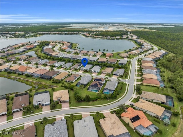 bird's eye view with a residential view and a water view