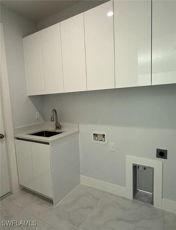 washroom featuring washer hookup, marble finish floor, cabinet space, a sink, and electric dryer hookup