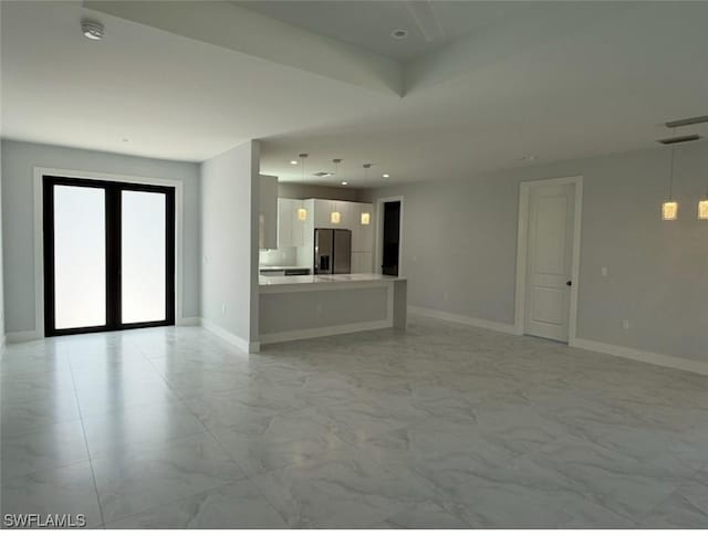 unfurnished living room with marble finish floor, recessed lighting, baseboards, and french doors