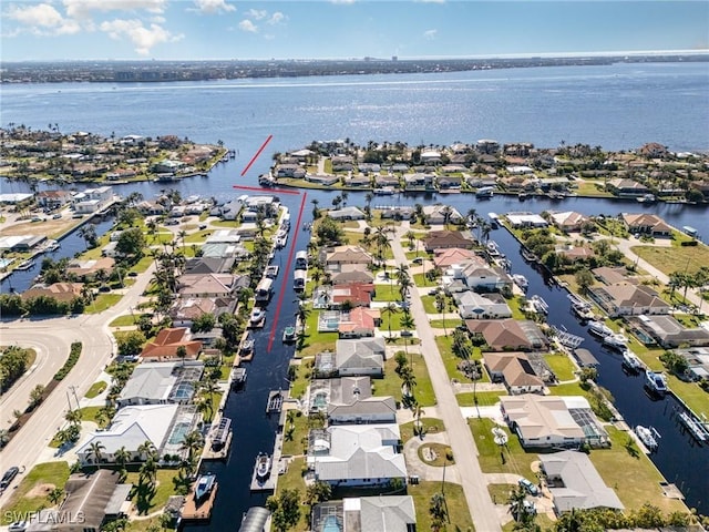 aerial view with a water view and a residential view