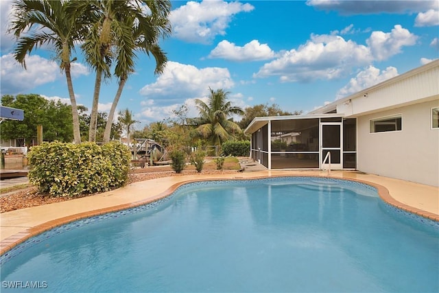 outdoor pool with a sunroom