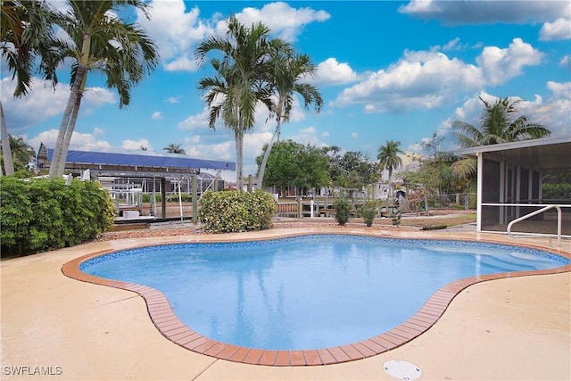 pool featuring a sunroom