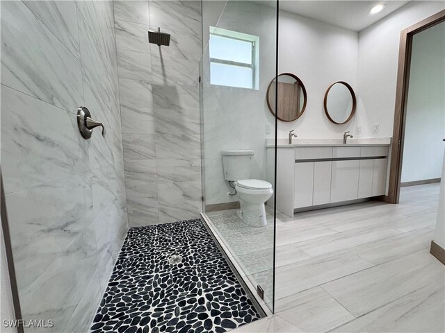 full bathroom with walk in shower, a sink, toilet, and double vanity