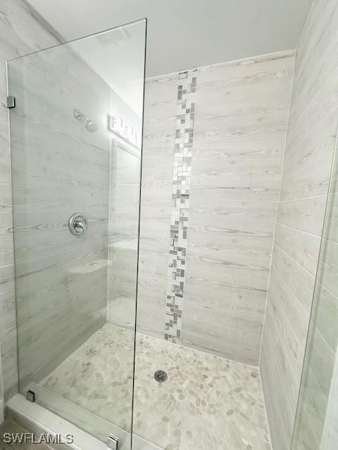 bathroom with a stall shower