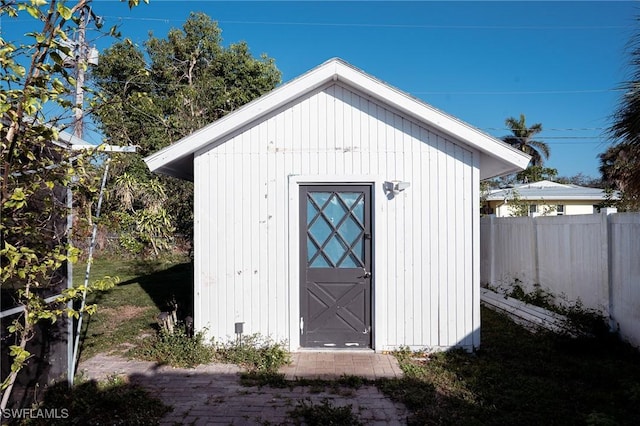 view of shed with fence