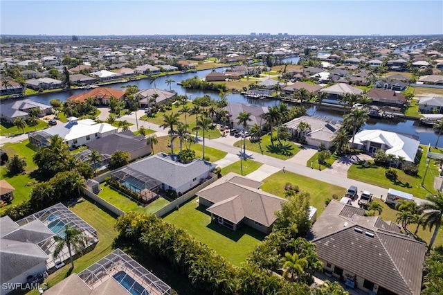 aerial view featuring a residential view and a water view