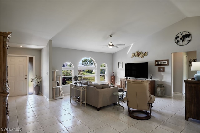 living room featuring lofted ceiling, light tile patterned flooring, ceiling fan, and baseboards