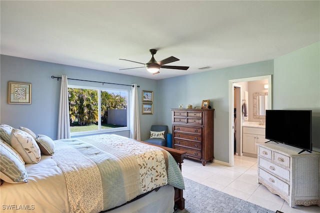 bedroom featuring light tile patterned floors, visible vents, ceiling fan, ensuite bath, and baseboards